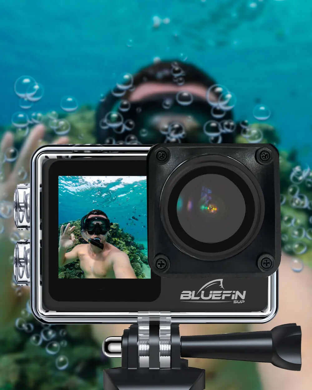 Underwater camera showing a diver taking a selfie, bubbles and coral visible in the background