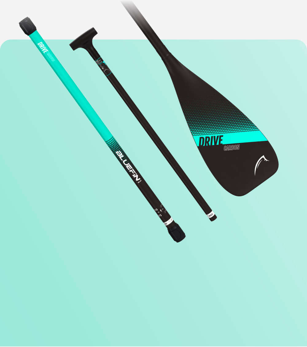 Bluefin SUP Drive paddle with a turquoise shaft and black blade, showcasing a textured grip.