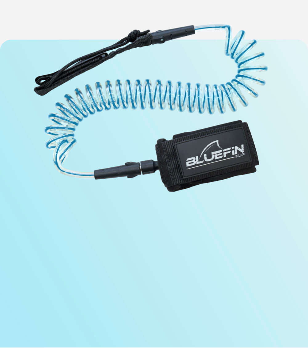 Coiled safety leash with black strap and BLUEFIN SUP logo, designed for paddleboarding.