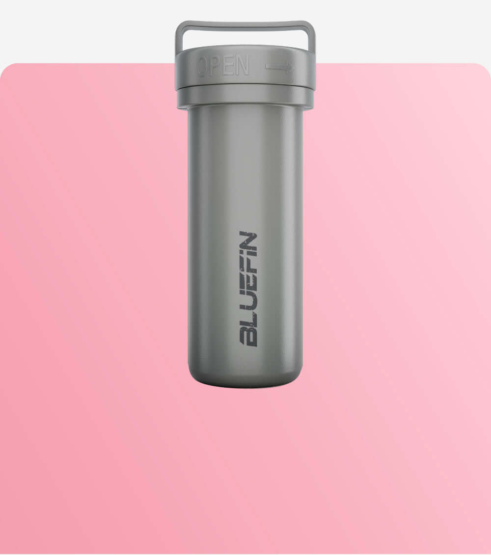 Gray waterproof container with an open lid, featuring the Bluefin logo on a pink background.