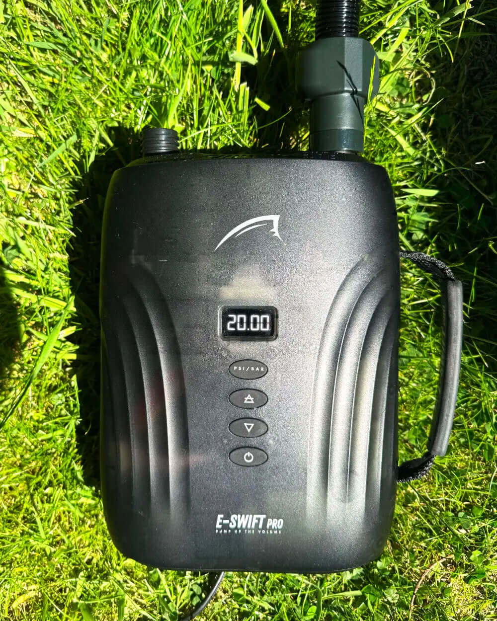 E-SWIFT PRO electric pump on grass, displaying 20.00 PSI on digital screen with control buttons.