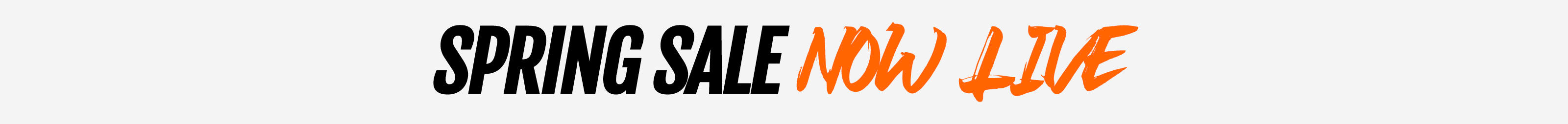Text graphic announcing "SPRING SALE NOW LIVE" in bold black and orange letters on a light gray background