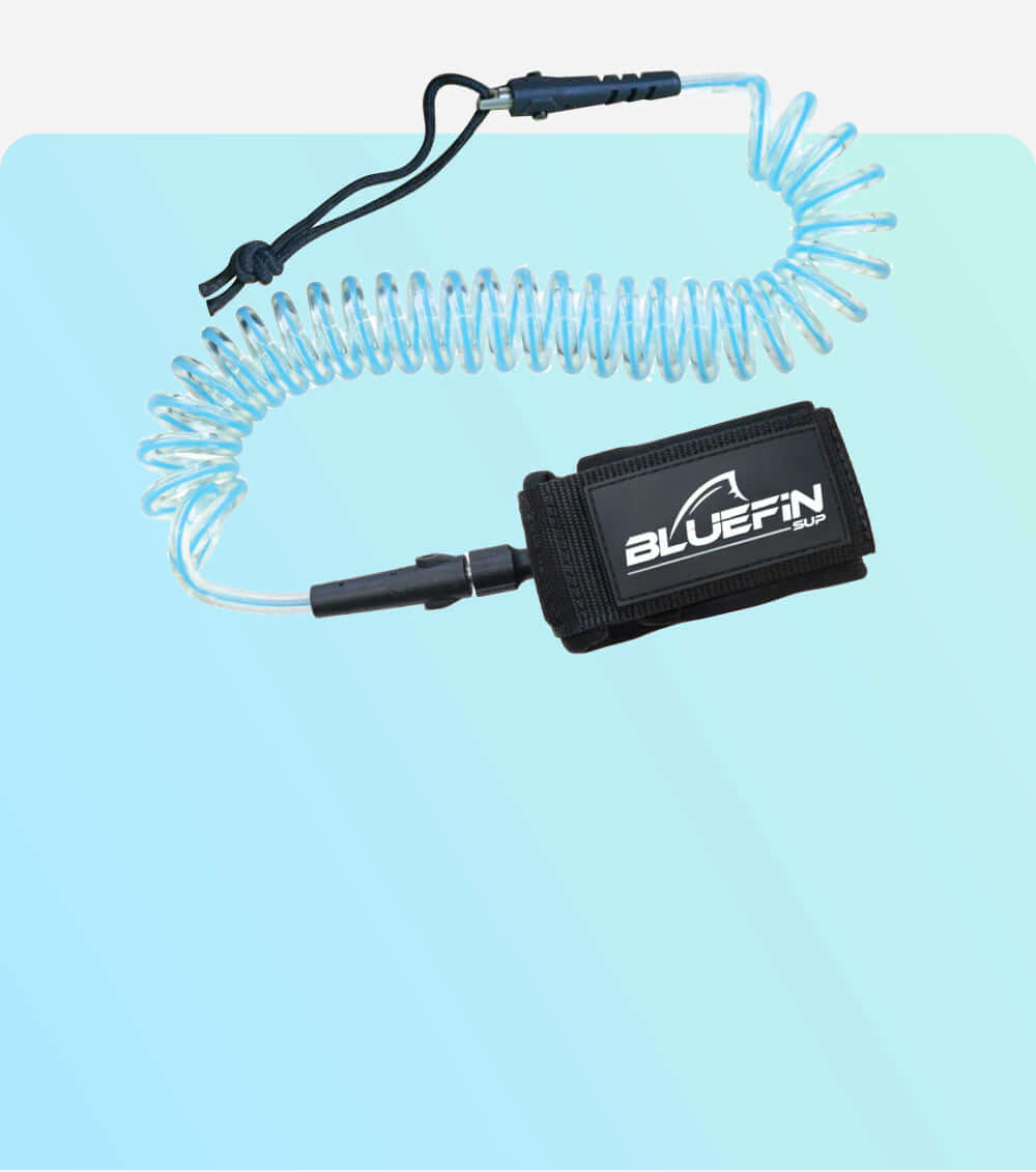 Coiled safety leash with black strap and Bluefin SUP logo, attached to a clear cord.