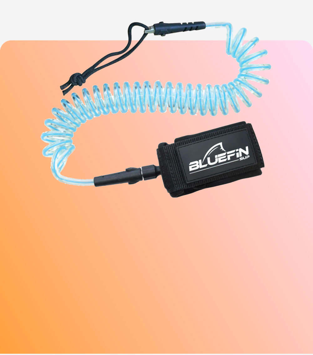 Coiled safety leash with black strap and BLUEFIN SUP logo, attached to a clear cord.