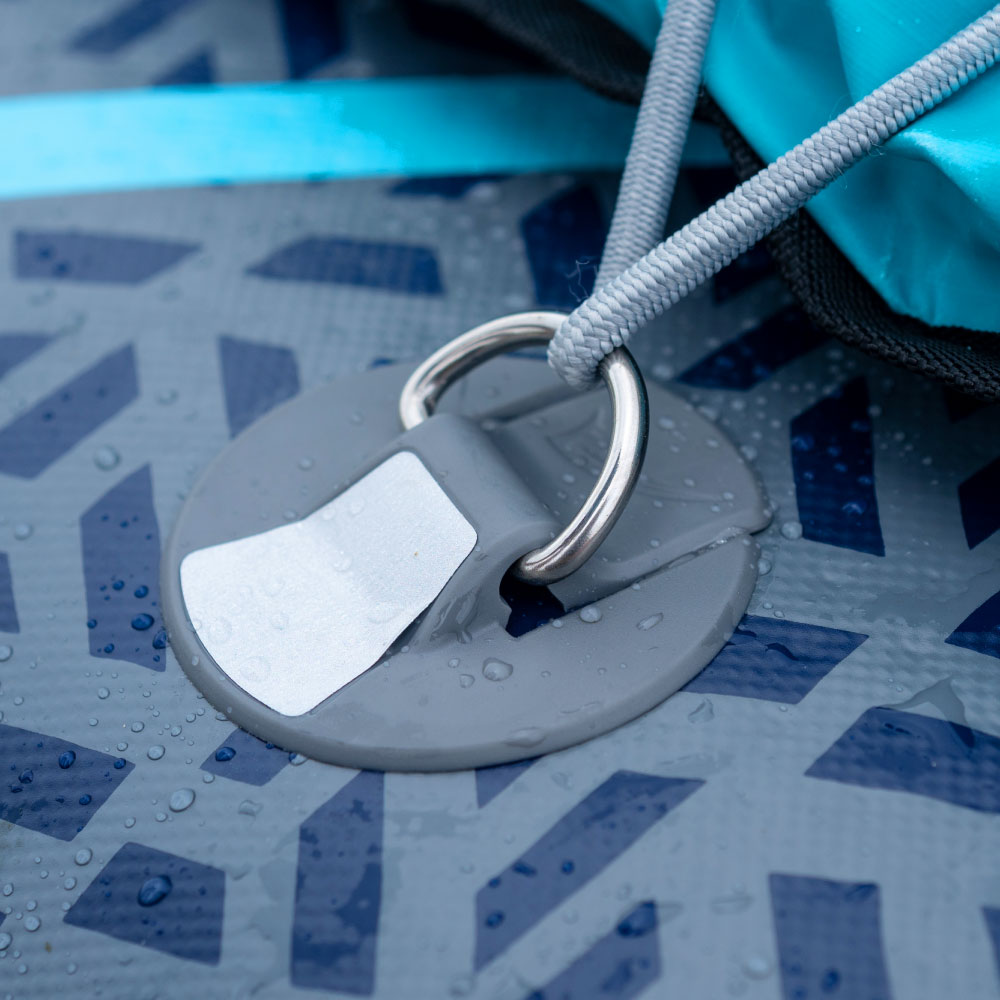 Close-up of gray D-ring attachment on a textured paddleboard surface with water droplets
